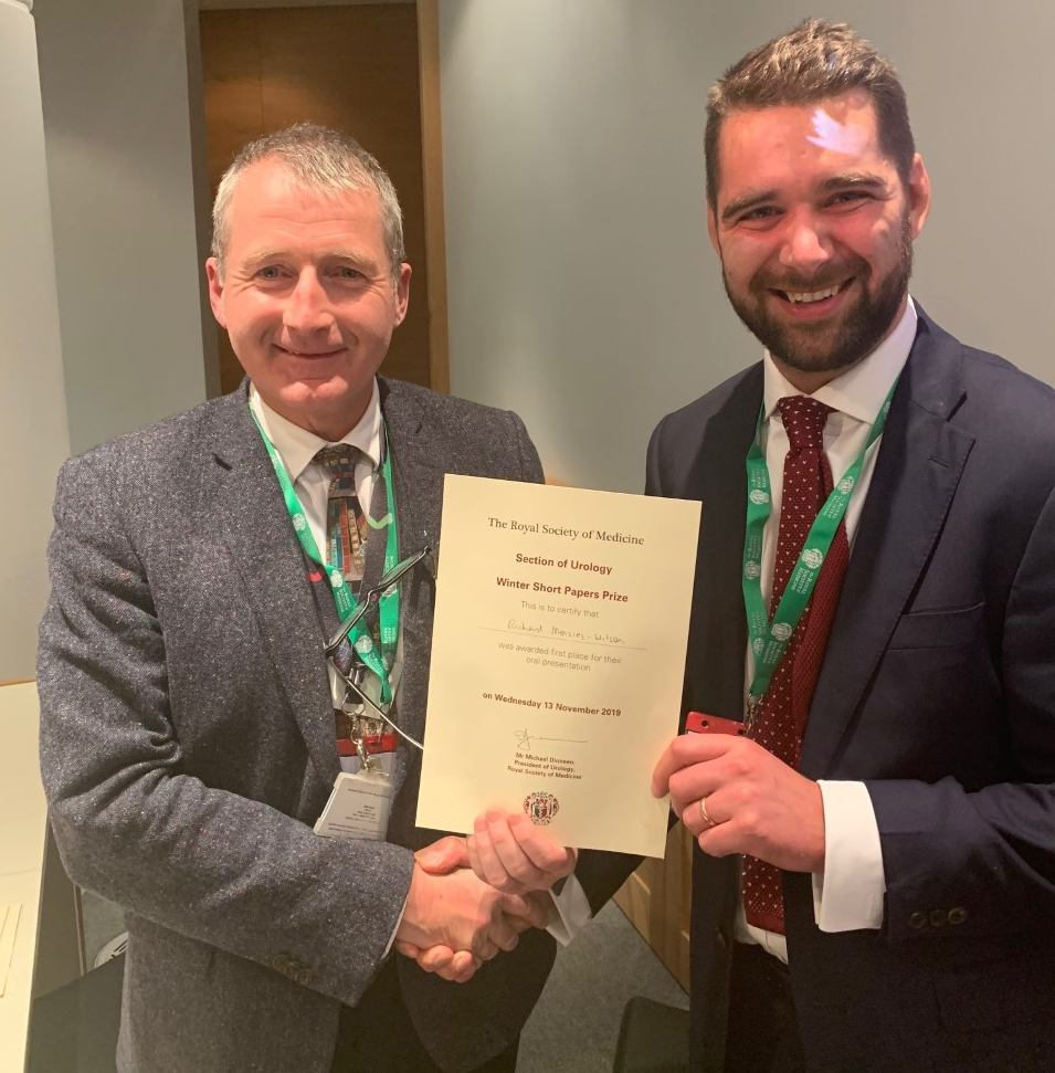 Mr Mike Dineen, President of the RSM Section of Urology presenting first prize, at the Winter Meeting on Innovation, to Mr Richard Menzies-Wilson, Clinical Research Fellow in Urology at Whipps Cross Hospital, Barts Health NHS Trust.