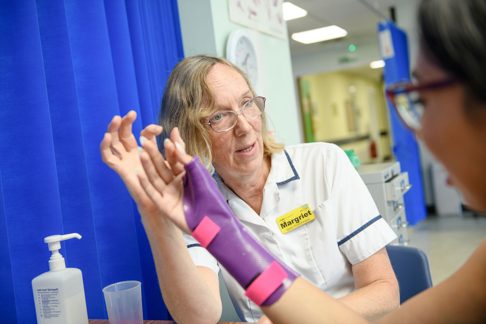Physiotherapist with patient arm at Newham Hospital