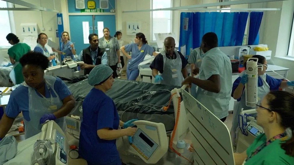 Staff in Newham's ITU moving critically ill patients - BBC photo